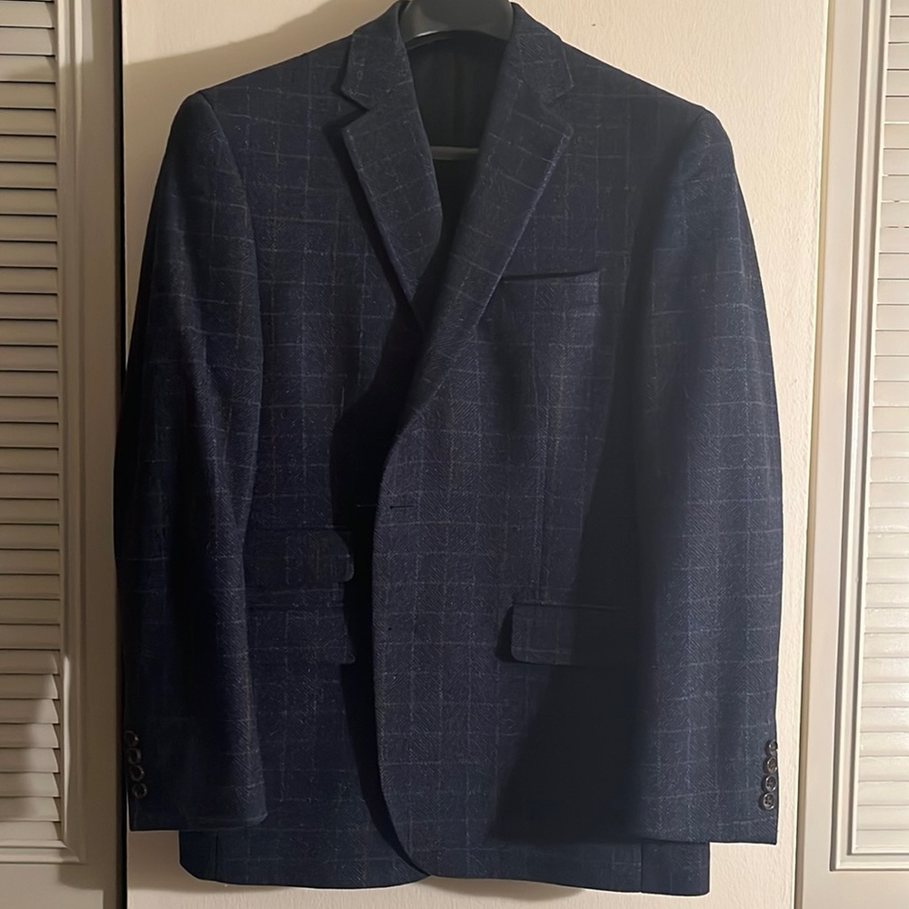 Beautiful navy wool blazer/w multi-color box print pattern.